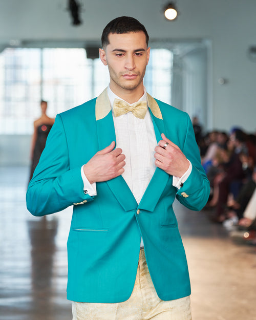 Sleek turquoise and yellow tuxedo blazer with yellow shimmery trousers