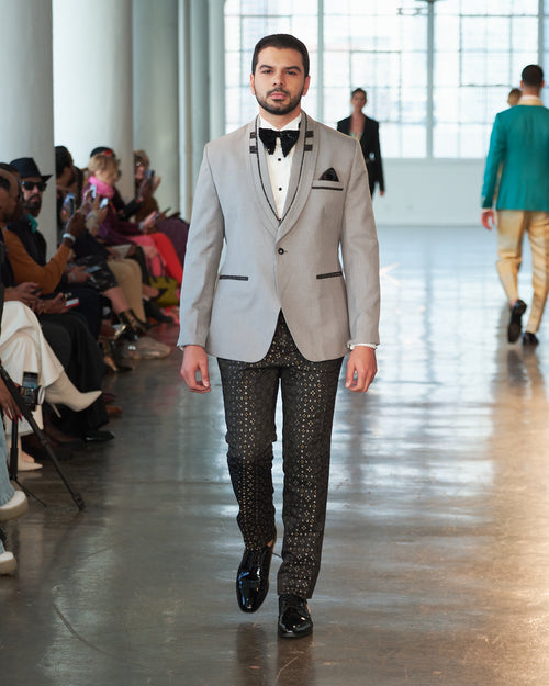 Stylish grey tuxedo jacket with custom lapel with black, silver and gold pattern trousers