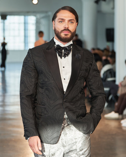 Exquisite black textured designed tuxedo jacket with shimmery silver and gray trousers. A true masterpiece!!!